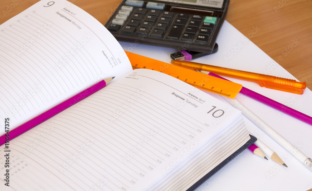The diary and pencil lie on the office Desk