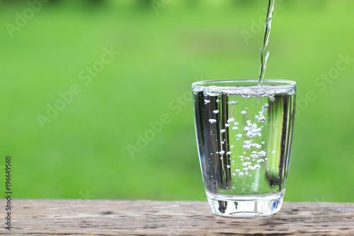 Closeup Glass of water on table nature background