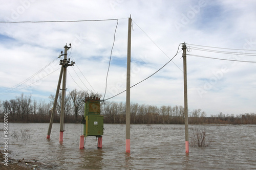 Transformer in flood. Danger of water and electricity.