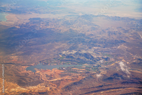 The rocky and desolate countryside of Las Vegas viewed from the heights of an airplane