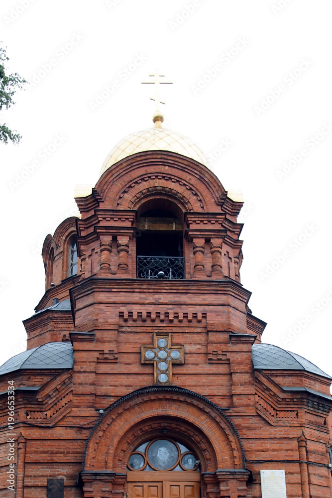 The Church is of red brick. Outside view