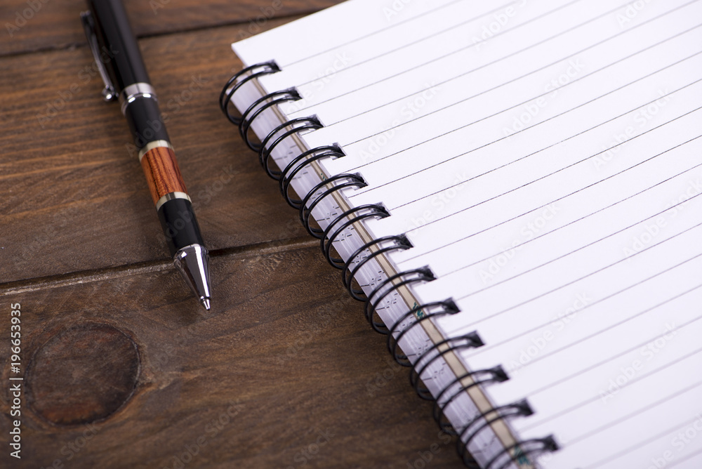 Spiral notebook rings next to ballpoint pen. Mockup. Spiral notebook rings next to ballpoint pen. Mockup.