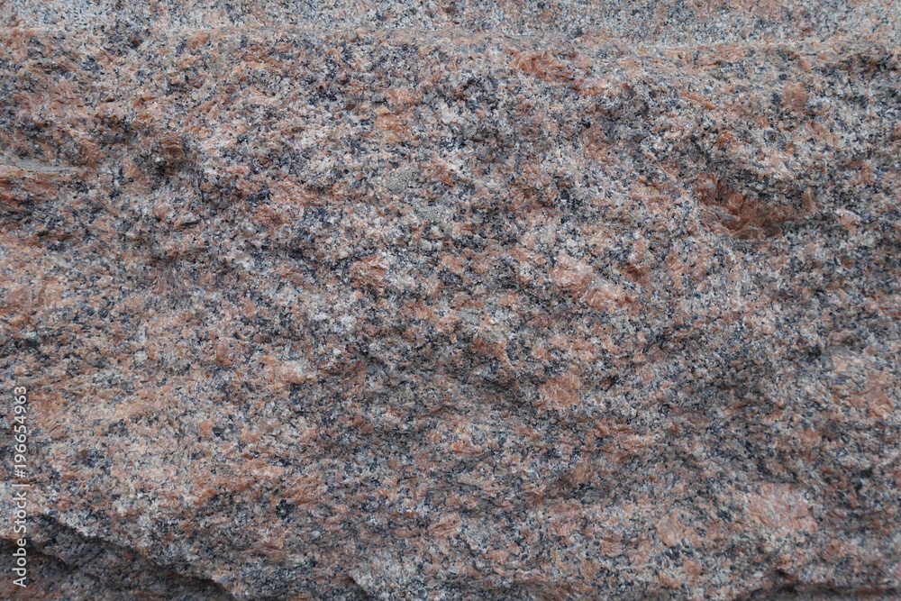 Deliberately rough surface of pink granite stone Deliberately rough surface of pink granite stone