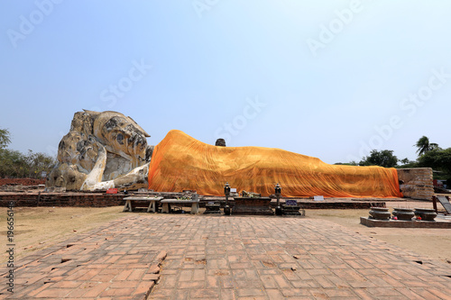 The great reclining Buddha with a bright orange sash is all that remains of Wat Lokaya Sutha. Ayutthaya, Thailand photo