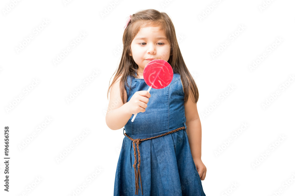 Little girl ready to lick round lollipop Little girl ready to lick round lollipop