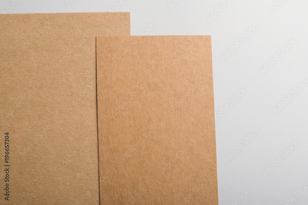 Cardboards of brown color on gray background. Mockup. Cardboards of brown color on gray background. Mockup.