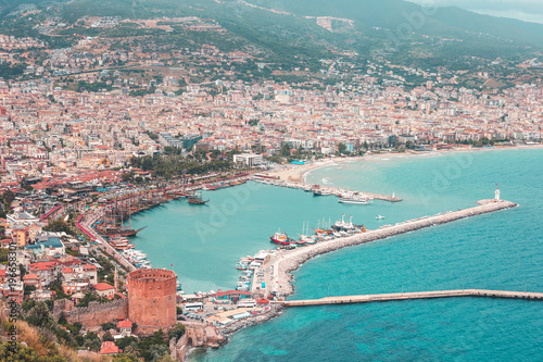 Red Tower in Alanya, Turkey. View on city, bay, ships, beach and Mediterranean Sea