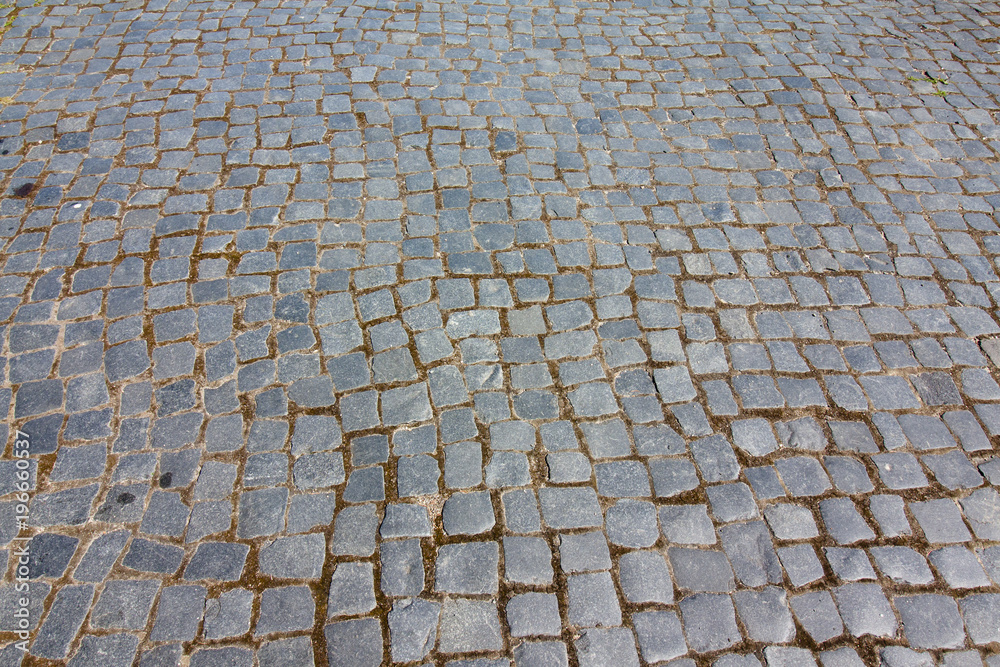 Gray paving slabs in the form of squares. Gray paving slabs in the form of squares.