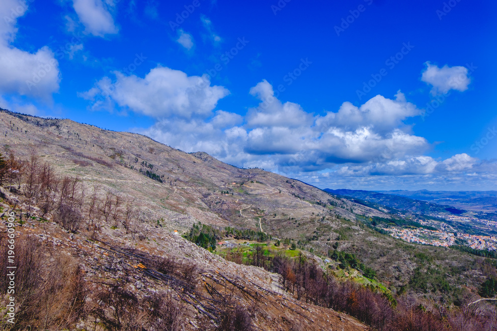 Fototapeta premium View of small Portuguese town Covilha and district Castelo Branco. View from mountains Serra fa Estrella. Summer day.