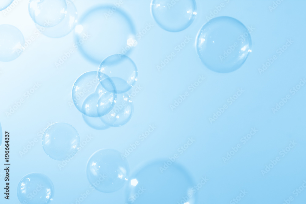 beautiful blue soap bubbles float background.