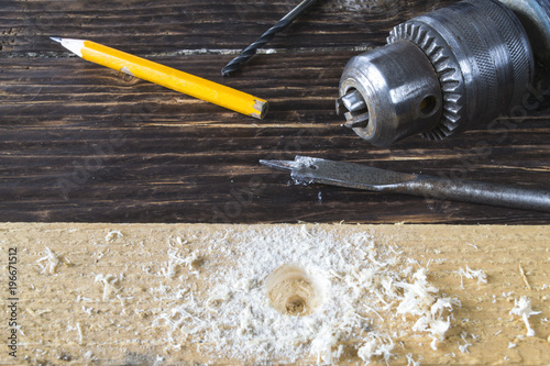 Drilling wood with old drill for furniture assembly