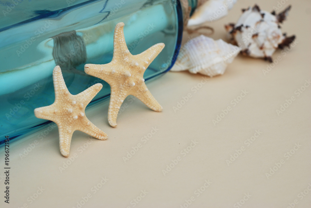 Nautical Theme Backdrop, Decorative Starfish on Neutral Ivory Background. Place for text. Selective focus. Nautical Theme Backdrop, Decorative Starfish on Neutral Ivory Background. Place for text. Selective focus.