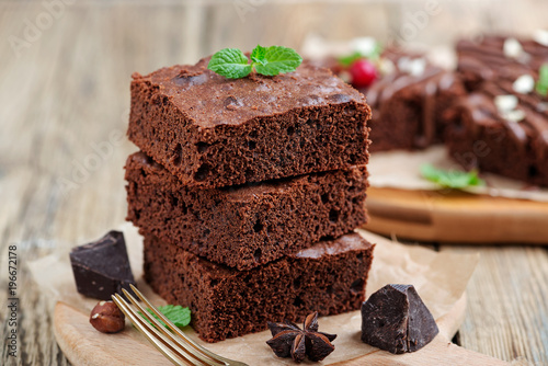 Cuadro en lienzo Chocolate brownie cake, dessert with nuts on wooden background.