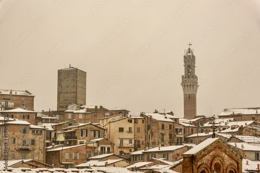 View of Siena in winter during a snowfall