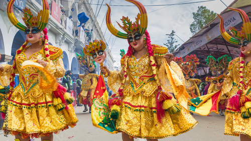 Oruro carnival in Bolivia with masked dancer during procession photo