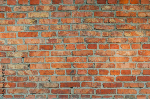 Old wall with red brick