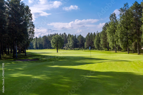 Landscape of golf field and hole flag