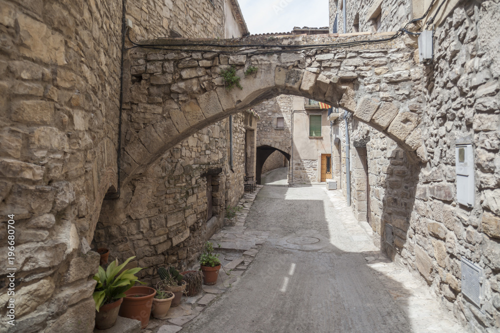  Old street in medieval village of Guimera, Province Lleida, Catalonia, Spain.