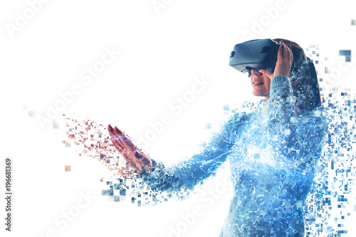 Obraz na płótnie A person in virtual glasses flies to pixels. The woman with glasses of virtual reality. Future technology concept. Modern imaging technology. Fragmented by pixels. w salonie