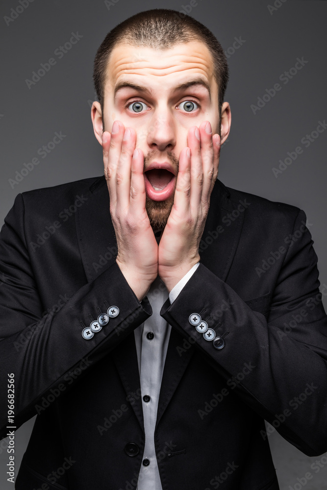 Isolated businessman with surprise expression on his face isolated on white background Isolated businessman with surprise expression on his face isolated on white background
