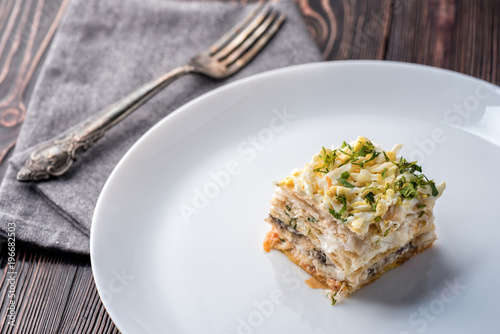 Fish pie with a dough, egg and fresh herbs photo