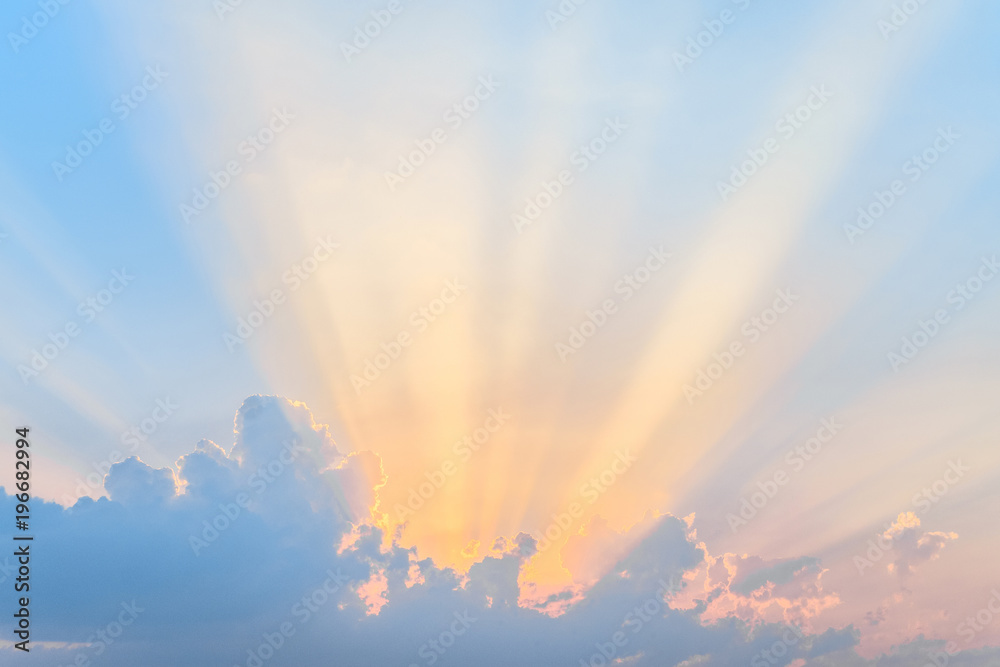 Sunset. Sun rays over the low clouds. Evening sky background. - obrazy, fototapety, plakaty 