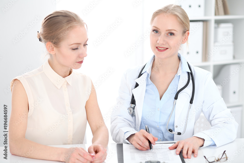 Doctor and patient during personal consulting in hospital Doctor and patient during personal consulting in hospital