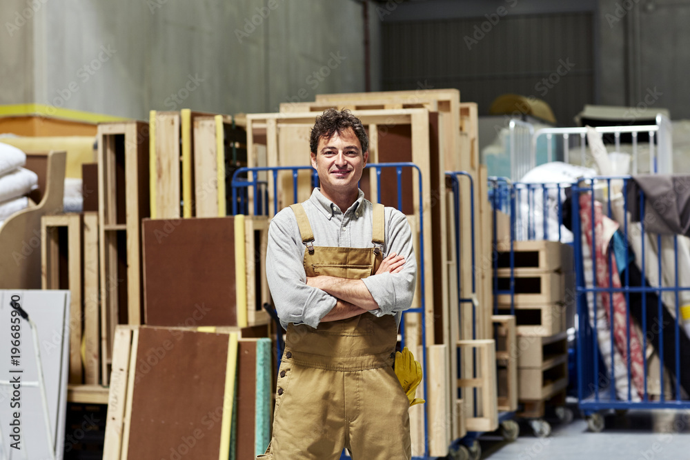Confident Male Worker Standing In Sofa Workshop Confident Male Worker Standing In Sofa Workshop