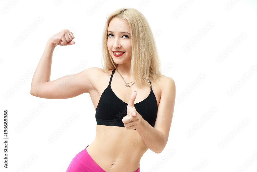 Obraz premium attractive young fit woman gesture strength isolated over white bakcground