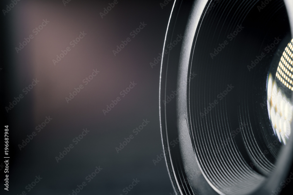 Photo Camera or Video lens close-up on black background, objective, concept of photographer camera man job, looking for a photographer, journalist, a videographer to work Photo Camera or Video lens close-up on black background, objective, concept of photographer camera man job, looking for a photographer, journalist, a videographer to work