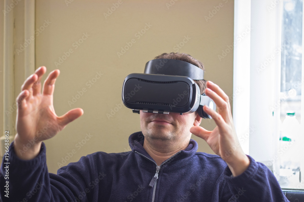 gaming, entertainment and people concept - senior man with virtual headset or 3d glasses playing videogame gaming, entertainment and people concept - senior man with virtual headset or 3d glasses playing videogame