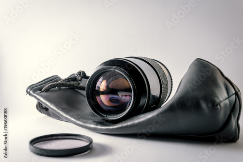 Close-up shot of photo lens on a white background.camera accessories, photographer concept design