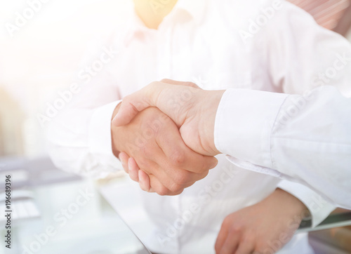 close-up handshake of business colleagues.