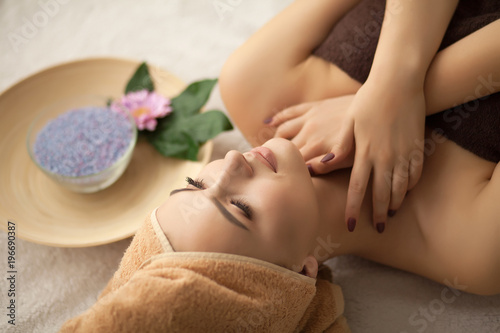 Spa. Woman enjoying anti-aging facial massage