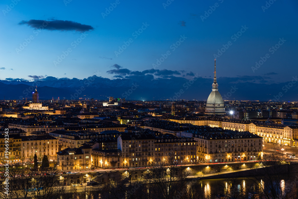 Naklejka premium Turin skyline at dusk, Torino, Italy, panorama cityscape with the Mole Antonelliana over the city. Scenic colorful light and dramatic sky.