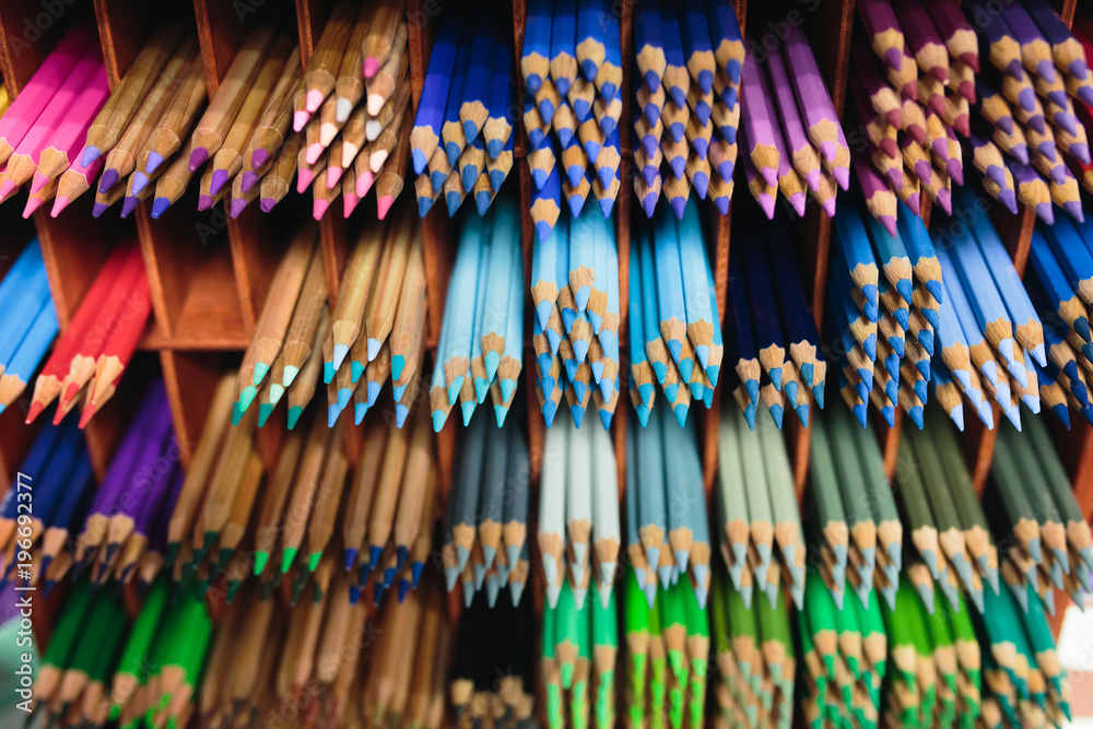 many multicolored pencils on the shelves