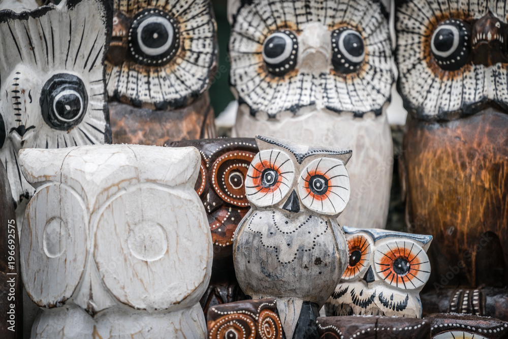 Fototapeta premium Wooden owls for sale