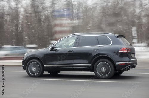 SUV driving on the highway in winter