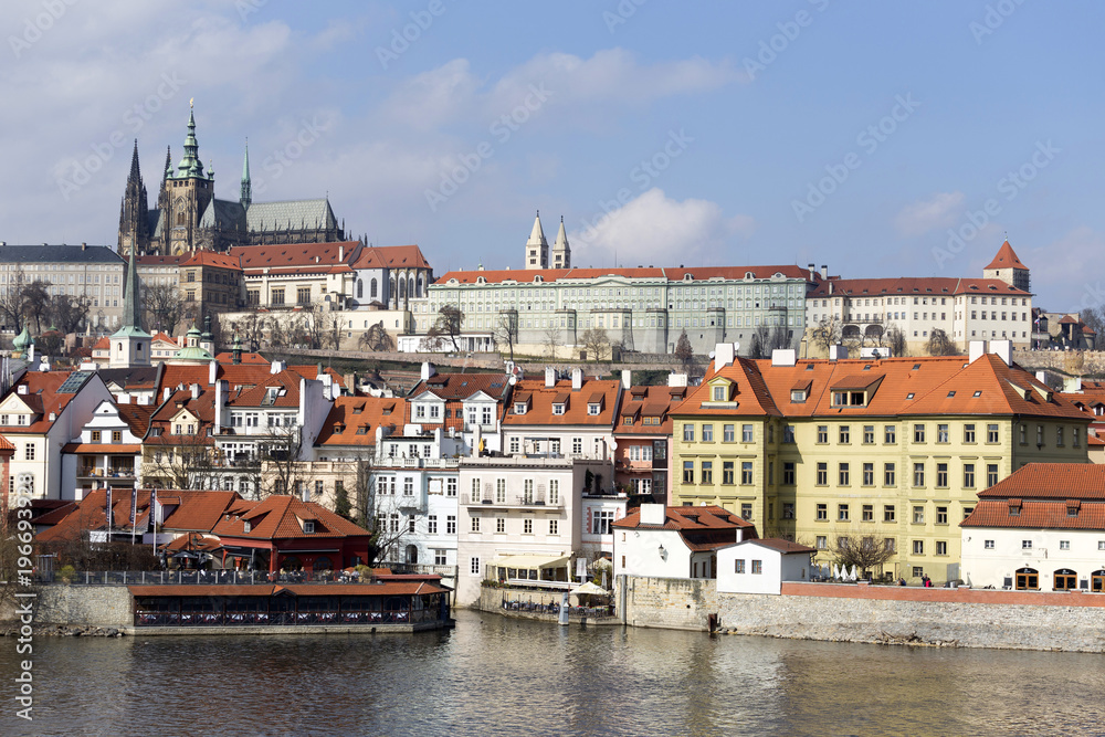 Early Spring Prague gothic Castle with the Lesser Town above River Vltava in the sunny Day, Czech Republic