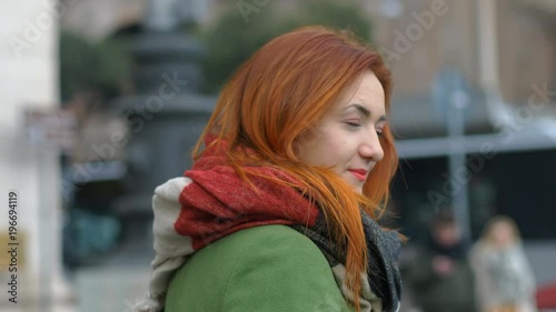 Wallpaper Mural young woman in the street walks turns and smiles at the camera Torontodigital.ca
