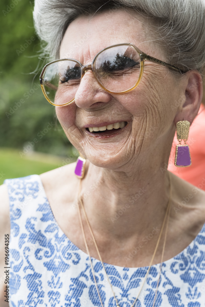 Playful happy senior woman laughing Playful happy senior woman laughing
