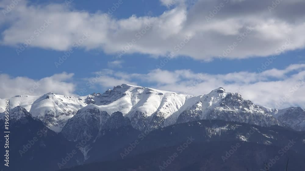 Clouds moving over the mountains full of snow Clouds moving over the mountains full of snow