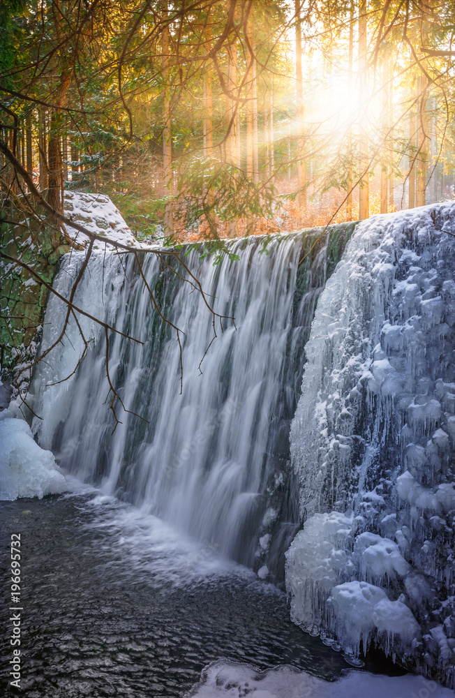 Naklejka premium Sunshine over Wild waterfall in Karpacz