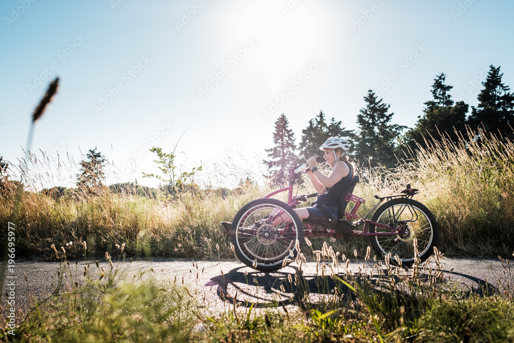 Disabled Active Woman Cycling in a Park Disabled Active Woman Cycling in a Park
