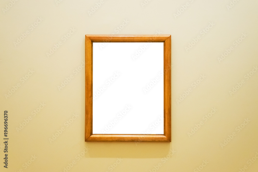 White clipped painting with wooden frame hung on a wall. White clipped painting with wooden frame hung on a wall.