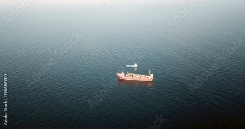 Aerial view of an offshore oil installation and supply ship