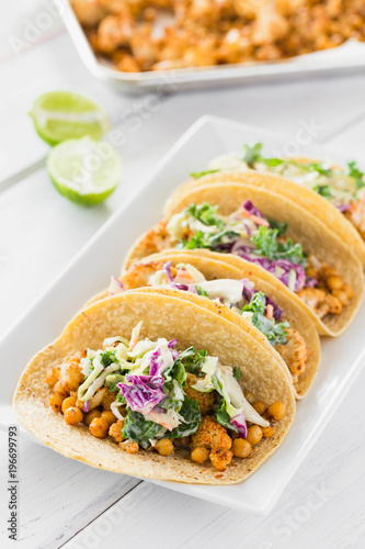 Chickpea Cauliflower Vegan Tacos with Cabbage Slaw Mexican Food on a Crisp White Wooden Background