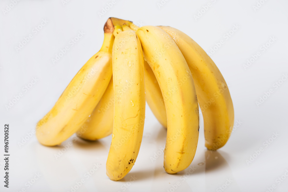 A bunch of bananas on a white background.