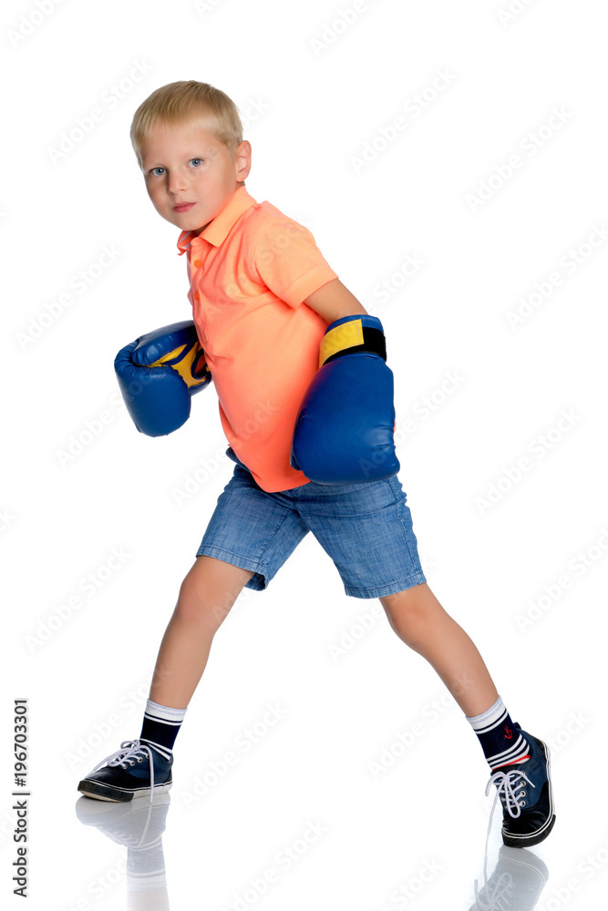 little boy in Boxing gloves.