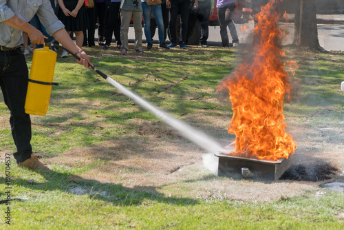Demonstration of the fire with a fire extinguisher.